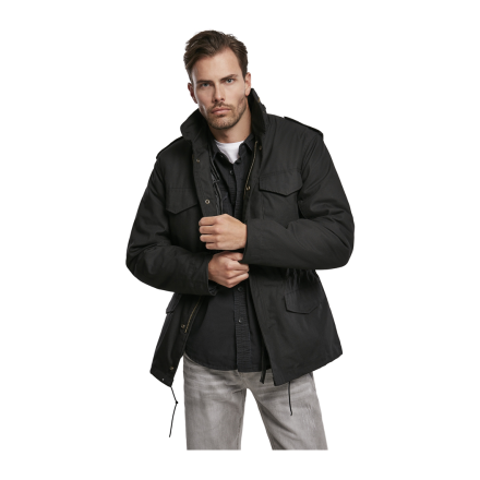 veste m65 classic brandit noire portée par un homme, coupe ample, capuche dans le col